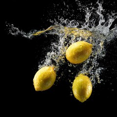 Citrus Fruits in Motion with Water and Splash Effect on Dark Background