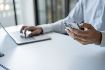 Successful Businessman Using Smartphone During Office Work