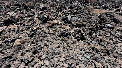 A breathtaking and stunning landscape that showcases rugged, textured lava rock formations within a volcanic region