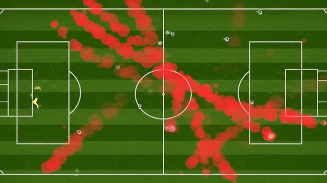Aerial view of a soccer field displaying player movement patterns with red heatmap indicators - Powered by Adobe