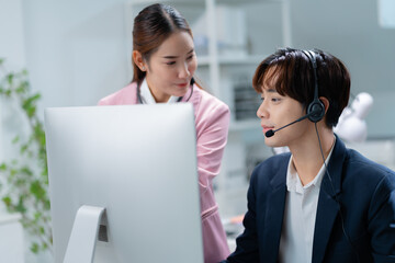 female asian operator taking job training,Leadership,training and mentor in call center coaching a telemarketing employee for quality customer services,insurance agent support
