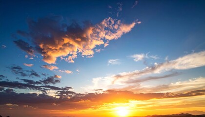 Fototapeta premium Dramatic orange and red sunset over the sea with a beautiful, bright sky full of colorful clouds