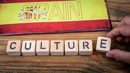 Spain Culture Concept with Wooden Blocks and National Flag