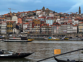 Fototapeta premium Romantic backstreet, side street or alley in historic old town of Porto Oporto, Portugal with colonial colorful tile style architecture facades, a landmark sightseeing tourist spot in old town