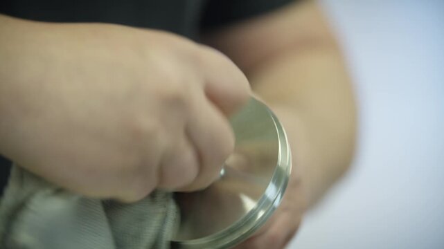 After laser welding, a piece of fabricated metal is wiped clean with a cloth