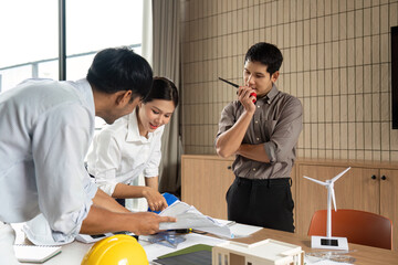 Sustainability in Action: Team Collaborating on Eco-Friendly Project Plans