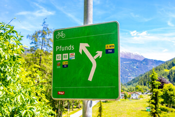 Green town and road direction sign in Tyrol Austria.