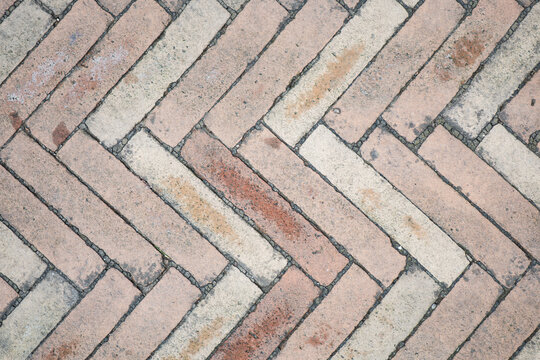 Intricate herringbone pattern creates artistic allure on urban walkway