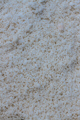 Pyramids of sea salt ready to be harvested in a salt farm at sunrise. Used as a seasoning in food, cosmetics and for food preservation.