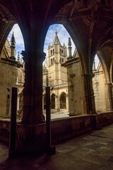 Bell tower view framed by gothic arches in Catedral de Leon cloister