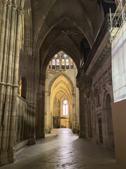 Side aisle of Leon Cathedral with view to transept rose window