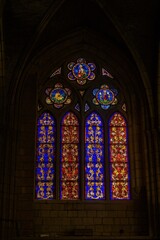 Gothic stained glass window with lily floral motifs in Catedral de Leon