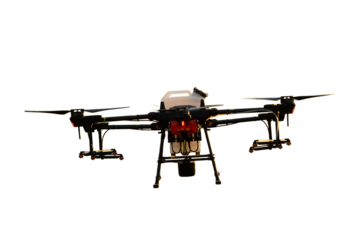 Agricultural technology smart farm concept. Farmer technicians remotely fly agricultural drones to fly to spray fertilizer in fields.