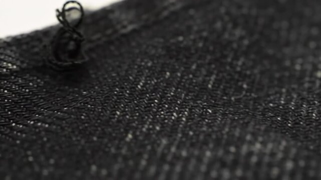 Close-up view of dark denim fabric