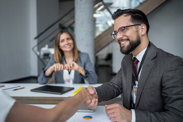 Business people shaking hands during a meeting in the office