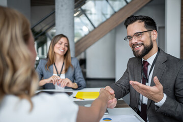 Businessman shaking hands with a client during a business meeting