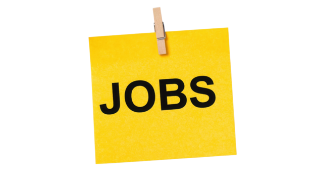 Yellow note with the word "JOBS" printed in bold black letters clipped by a wooden clothespin.