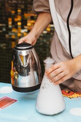 Kid Pouring Hot Water into Flask Creates Chemical Reaction