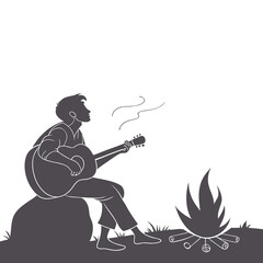 Silhouette of Man Playing Guitar by Campfire Outdoors
