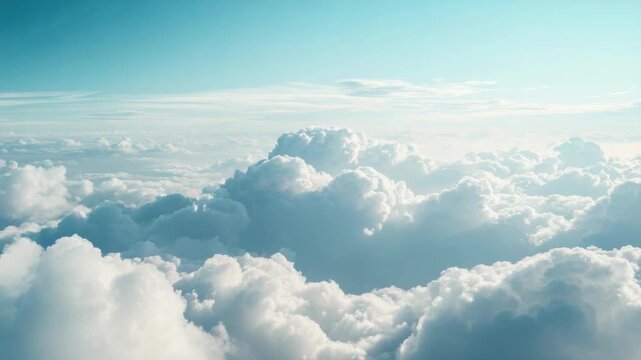 Cloudy sky above the atmosphere. Aerial view of high altitude fluffy clouds against a vast expanse.