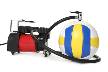 Volleyball ball and air compressor isolated on white