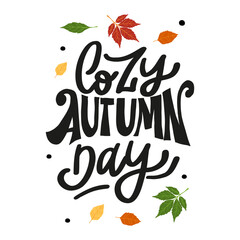 Cozy handwritten phrase "Cozy Autumn Day" in brown and orange tones. Ideal for fall decor, prints, or seasonal apparel.