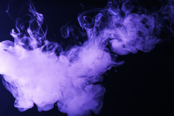 Hookah smoke in violet light on black background, closeup