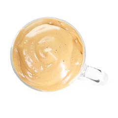 Delicious dalgona coffee in glass cup isolated on white, top view