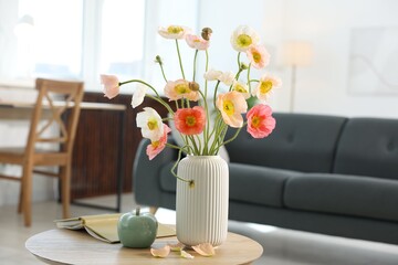 Beautiful poppy flowers and decor on table at home