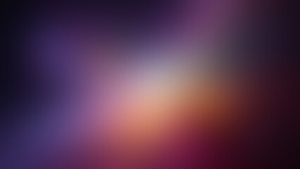 Photo of a soft grainy gradient of purple pink and orange hues with a bright light in the center