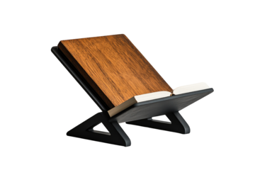 A dark gray, adjustable book stand holds an open book with a wooden cover