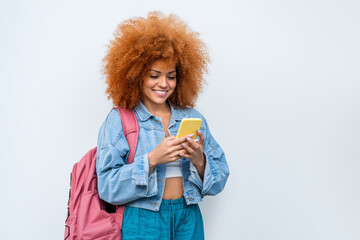 Isolated portrait of young female woman student holding mobile cell phone for online chat call. Happy African American girl using smartphone app for communication, connection, watching social media
