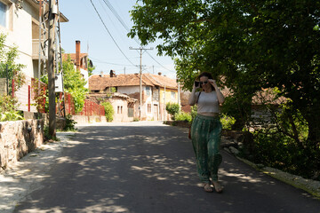 Woman walking in the street of a village 