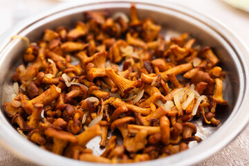 traditional dishes of Eastern European cuisine. Fried chanterelles in pan