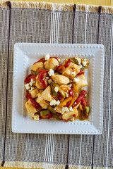 Greek chicken stir fry with red bell pepper, olives, and feta cheese