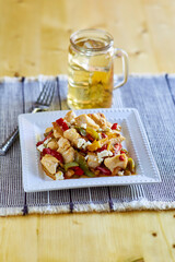 Greek chicken stir fry with red bell pepper, olives, and feta cheese
