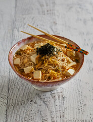 kimchi tofu soba soup topped with seaweed
