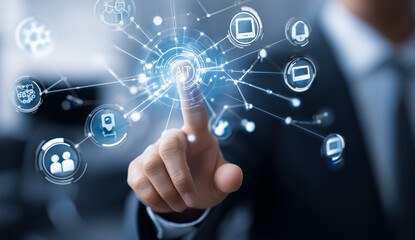 Businessman interacting with a digital network of icons and connections.