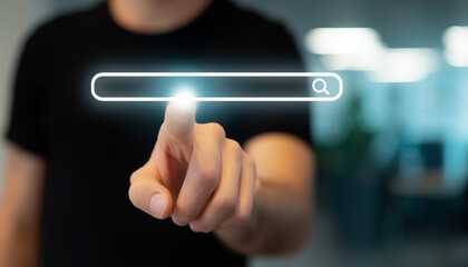 Person interacting with a virtual search bar in a modern office setting