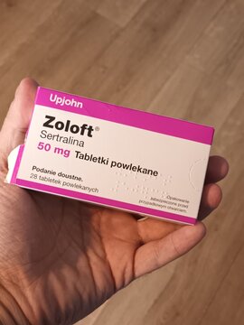 Hand Holding a Zoloft (Sertraline) 50mg Medication Box