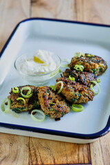 ground lamb and leek patties served with a yogurt tahini sauce