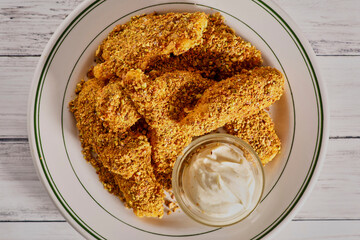 pistachio nut crusted chicken tenders with a curry mayo dipping sauce