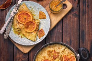 Sweet thin French crepes Suzette with orange sauce 