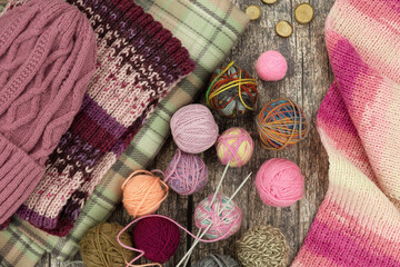 Yarn for knitting and warm clothes. Knitting hats and scarves from yarn. Knitting is a type of handicraft.