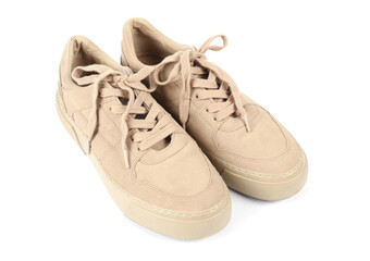 Pair of stylish beige sneakers on white background