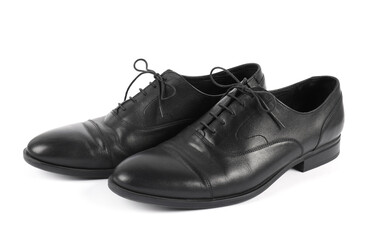 Pair of black leather shoes on white background