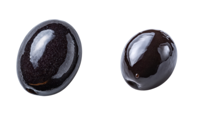Two shiny black olives on a white background. Food, ingredient, gourmet, organic, healthy, eating, Mediterranean cuisine