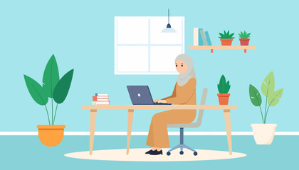 Muslim woman in a hijab working on a laptop at a desk in a modern, plant-filled home office.