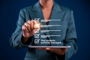 Businesswoman checking off tasks on a digital checklist on a tablet