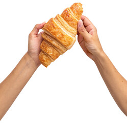 two hands holding croissants